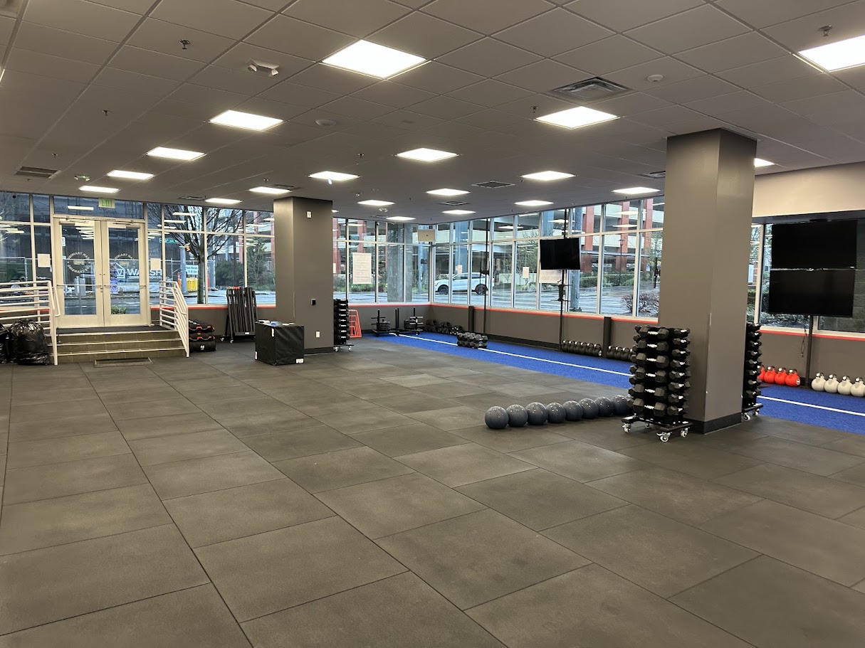 Open gym floor with large windows at F45 Northgate