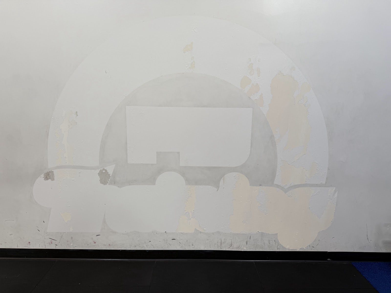 Studio wall with patched sections being prepared for finish