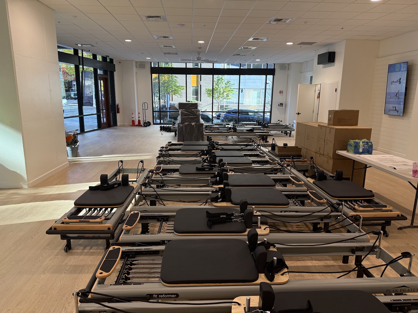Rows of Pilates reformers installed in the finished FS8 studio