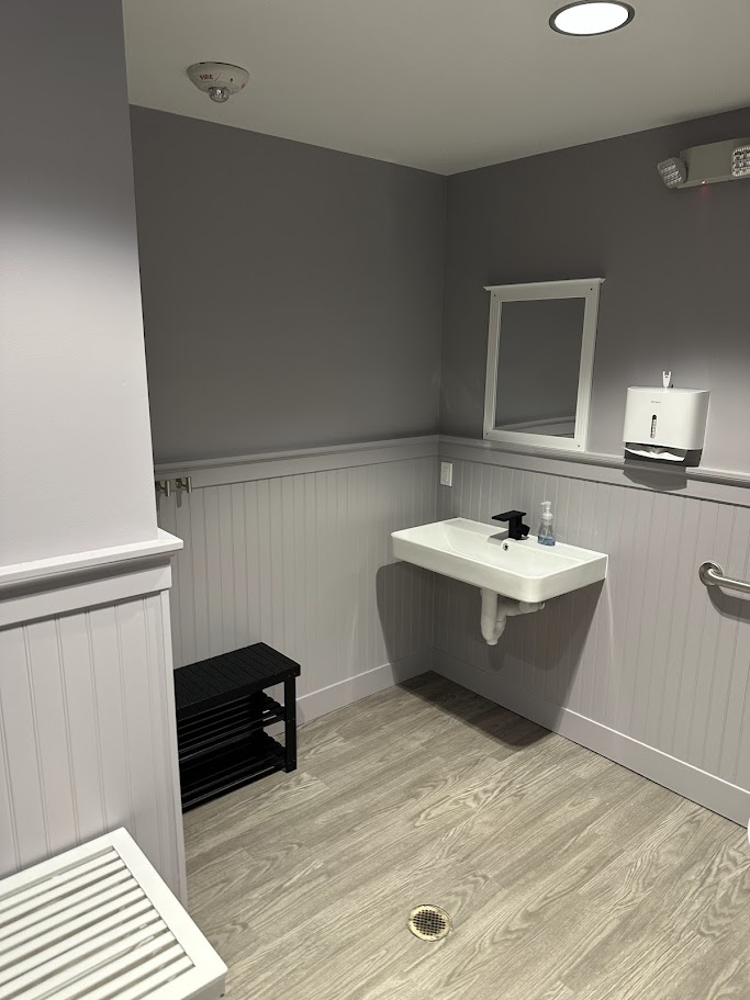 Restroom with wall-mounted sink at F45 Northgate